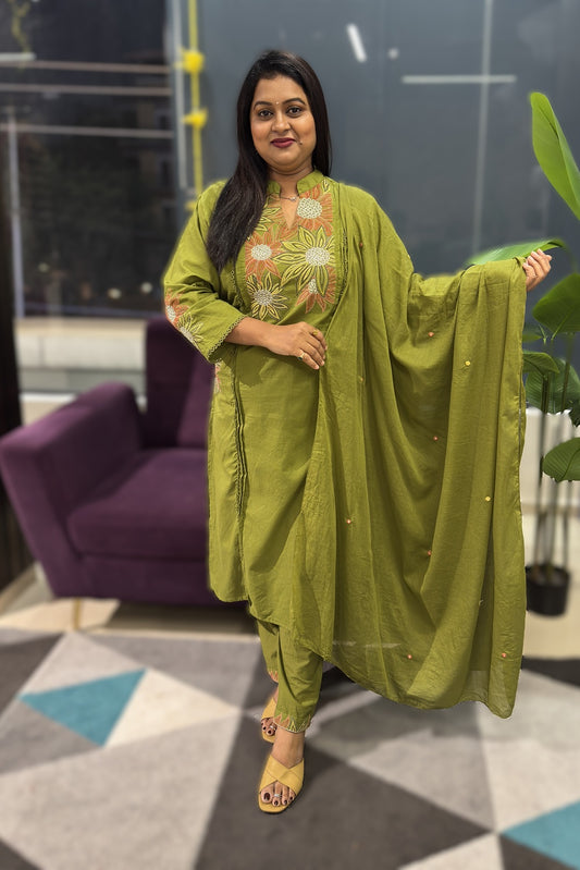 Green Cotton Suit with suttle embroidery and pocktes on both the sides