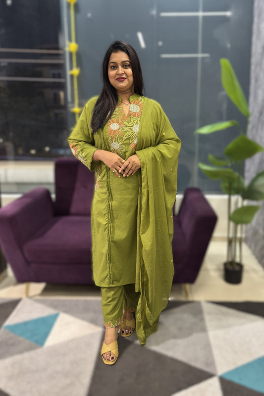 Green Cotton Suit with suttle embroidery and pocktes on both the sides