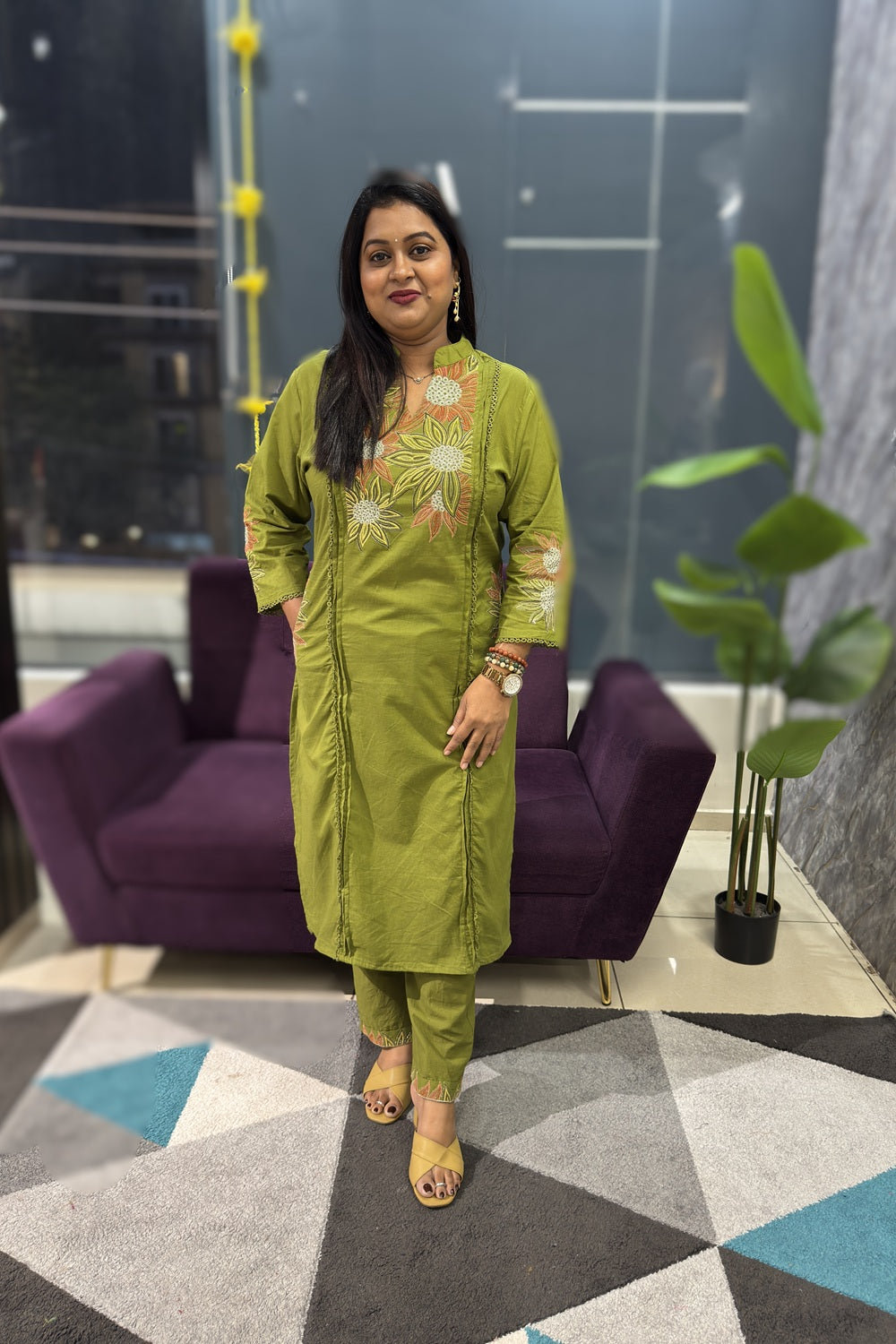 Green Cotton Suit with suttle embroidery and pocktes on both the sides