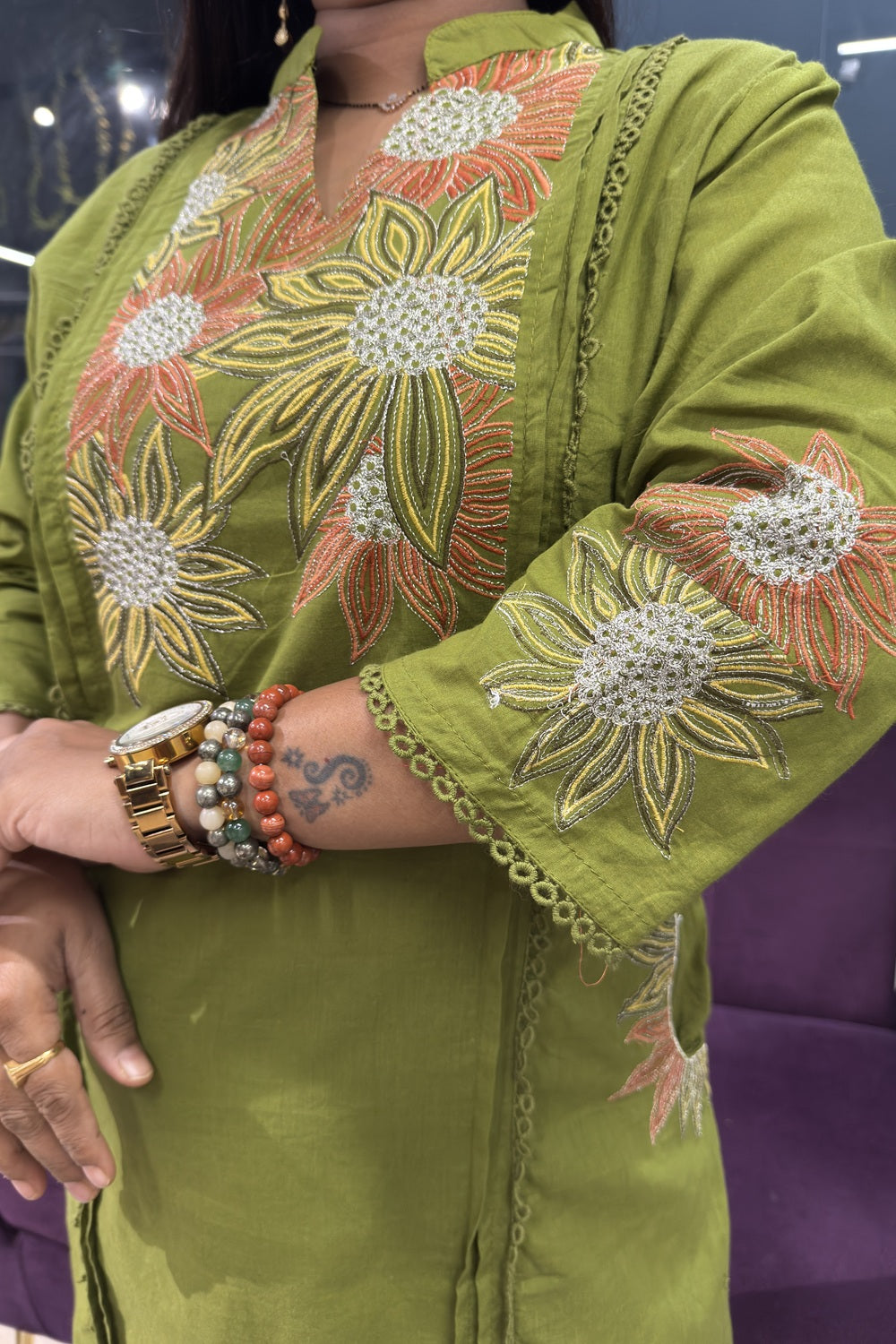 Green Cotton Suit with suttle embroidery and pocktes on both the sides