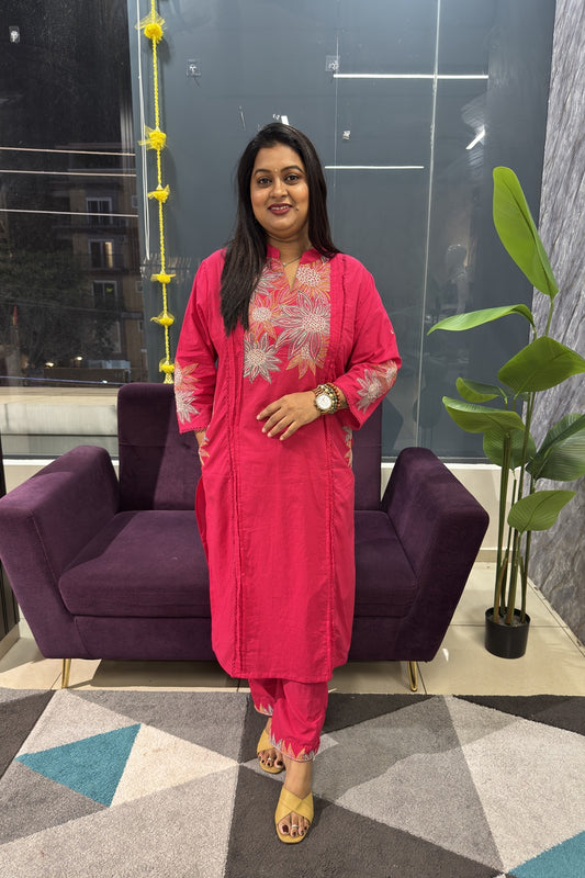 Pink Cotton Suit with suttle embroidery and pocktes on both the sides